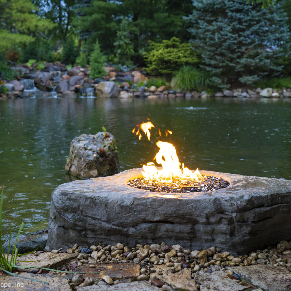 A Fire Pit Stone next to a pond